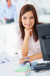 Pretty young business woman relaxing at work