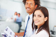 Colleagues going through a business document, focus on female