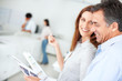 Team of happy colleagues going through a business document