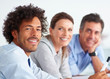 Closeup of an African American business man at work, colleagues