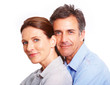 Closeup of a sweet couple embracing against white background
