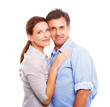 An attractive couple standing against white background