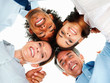 Upward view of a group of happy business colleagues with their h