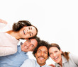 Upward view of a group of happy business colleagues with their h
