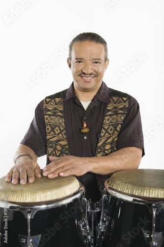 Photo: Hispanic bongo drum player Hispanic bongo drum player