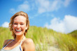 Pretty happy woman smiling outdoors