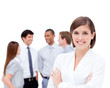 Confident manager in front of her team with folded arms