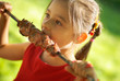 The girl eats a  kebab