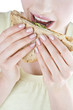 A Young Woman Eating A Sandwich