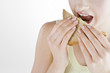 A Young Woman Eating A Sandwich