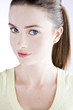 A Head And Shoulders Portrait Of A Young Woman