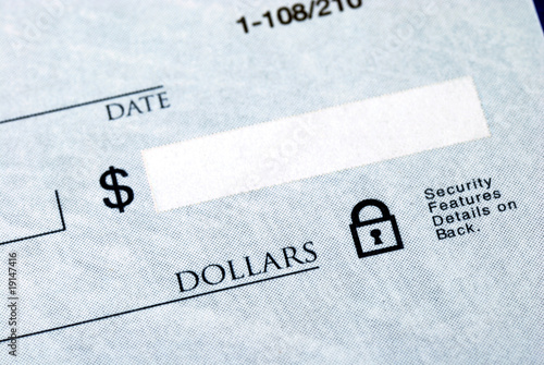 Photo: Write the dollar amount on the check Write the dollar amount on the check