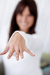Young female with an engagement ring , focus on hand