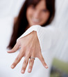 Young woman showing her engagement ring , focus on hand