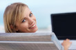 Portrait of a happy young woman using a laptop