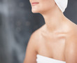 Mid section of a woman in a towel after bath