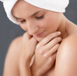 Closeup of a shy woman at the bath , hands crossed at chest
