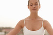 Young woman practicing yoga outside