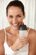 Pretty happy woman with a water bottle