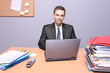A view of a happy businessman in the office A view of a happy businessman in the office