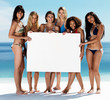 Group of females with an empty billboard at the beach