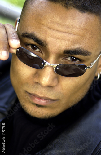 Photo: African American man wearing fashionable sunglasses African American man wearing fashionable sunglasses