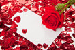 Red rose and blank invitation card