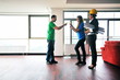 happy young couple buying new home with real estate agent
