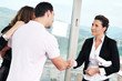 happy young couple buying new home with real estate agent