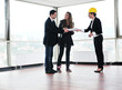happy young couple buying new home with real estate agent