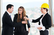 happy young couple buying new home with real estate agent