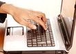 Closeup of hand on laptop