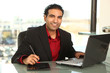 Hispanic Businessman Working on Laptop Hispanic Businessman Working on Laptop