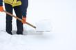 Man digging a path from the snow