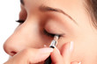 Woman applying eyeshadow makeup Woman applying eyeshadow makeup
