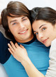 Closeup of a happy young couple lying together