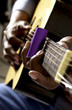 African American man playing guitar