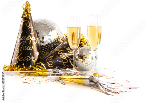 Champagne glasses with festive party hats on white