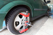 green car on repair in car-care center