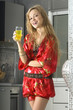 blonde in modern kitchen with juice