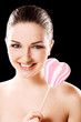Woman with heart shaped lolly