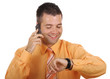 Telefonierender Mann schaut auf Uhr