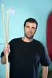 Billiard player man holding pool sticks