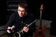 male play in study on saxophone