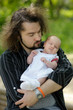 Newborn baby in father's hands