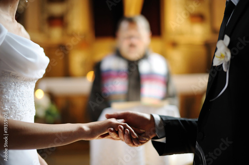 Photo: Bride and groom holding each other's hands Bride and groom holding each other's hands