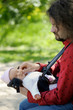 Little newborn baby in father's hands