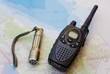 Walkie talkie and torch on map