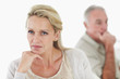 Relationship issues - middle aged  couple with hand on chin