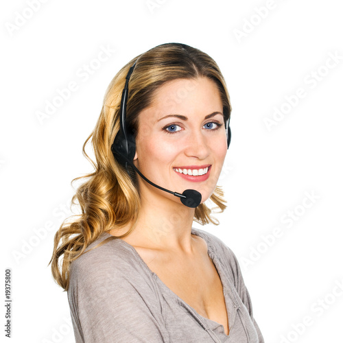 Foto: Blonde Frau arbeitet mit Headset im Call-Center Blonde Frau arbeitet mit Headset im Call-Center